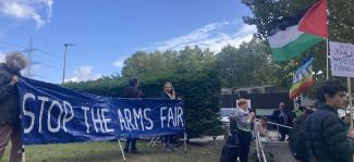 Photo from DSEI protest 2025 Protesters holding a banner that says Stop The Arms Fair